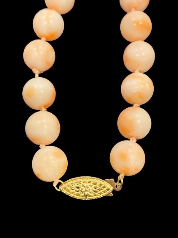 Angel Skin coral bead necklace and matching earrings.